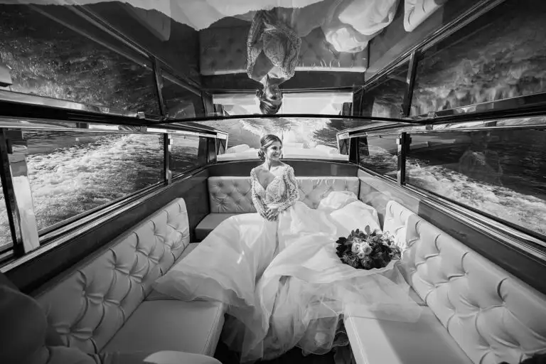 beautiful bride enjoys a boat ride on Lake Como