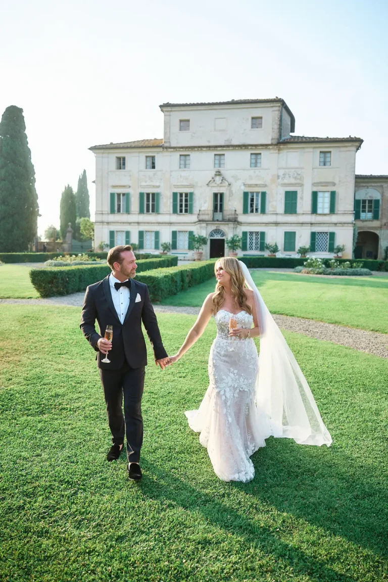 couple enjoys champagne at their private villa wedding in Tuscany